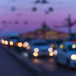 Abstract defocused image of cars driving at dusk