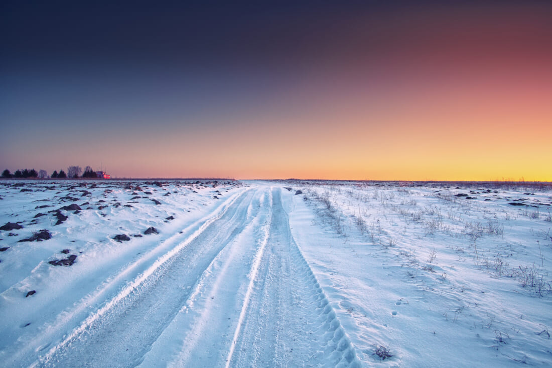 traces of the car wheels on a snowy road