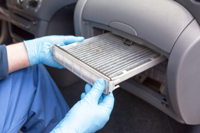 Replacing dirty cabin pollen air filter for a car